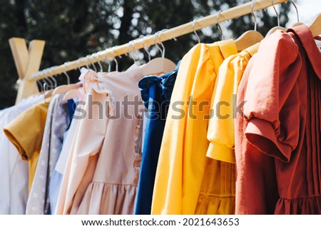 Clothes for children are sewn with their own hands. Sale of clothes made of natural fabrics. Royalty-Free Stock Photo #2021643653