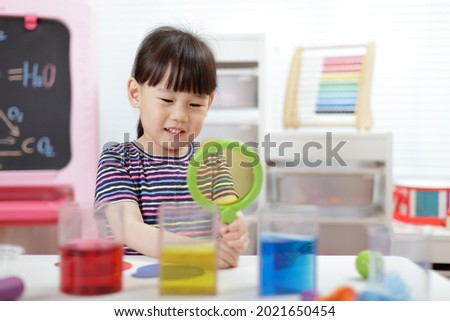 young girl  play science experiments for homeschooling 