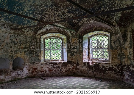 the interior of an abandoned temple, the temple complex of the village of Ilyinsky on the Shacha River, Kostroma region, Russia, built in 1760, 1772. The complex is currently abandoned Royalty-Free Stock Photo #2021656919