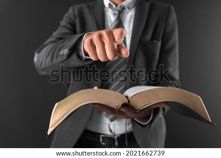 young man hand Bible and you sign
