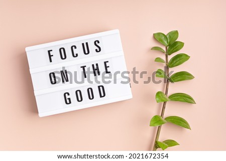 Lightbox with text focus on the good. Mental health, positive thinking idea