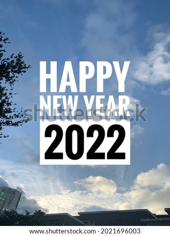 Happy new year 2022 on blue sky background.