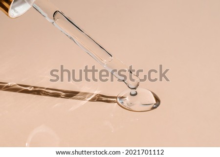 A drop of cosmetic oil falls from the pipette Royalty-Free Stock Photo #2021701112
