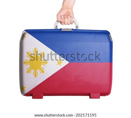 Used plastic suitcase with stains and scratches, printed with flag, Philippines