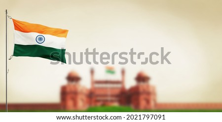 NDIA FLAG FLYING HIGH WITH PRIDE india independence day and republic day of India red fort background Royalty-Free Stock Photo #2021797091