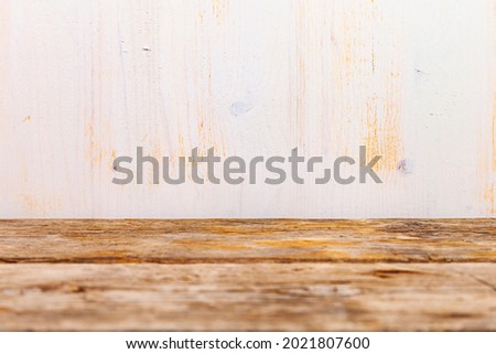 Wooden background. Beautiful brown old boards and light wall. Beautiful  background for your photo.