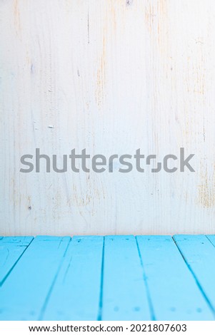 Wooden background. Beautiful light  and blue wall. Beautiful  background for your photo.