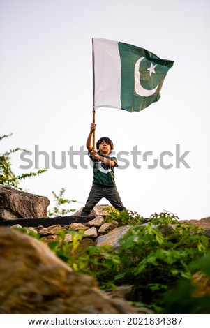 cute little boy celebrating Pakistan independence day at F-9 Park, Islamabad, Pakistan. Royalty-Free Stock Photo #2021834387