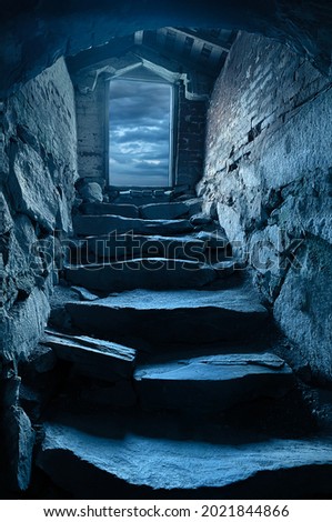 Dark steep stone stairs to cellar dungeon