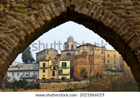 The City of Ripatransone, Ascoli Piceno, Italy viewed through an arch Royalty-Free Stock Photo #2021866019