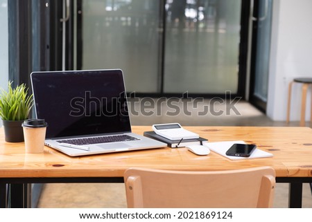 Modern office room with blank screen table.	
