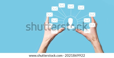 Male hand holding letter icon,email icons .Contact us by newsletter email and protect your personal information from spam mail. Customer service call center contact us.Email marketing and newsletter.