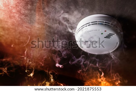 Smoke detector and fire alarm in action background with copy space Royalty-Free Stock Photo #2021875553