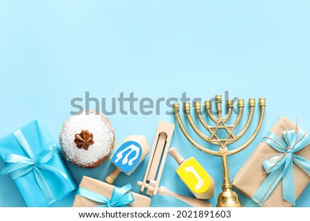 Composition for Hanukkah celebration on color background Royalty-Free Stock Photo #2021891603