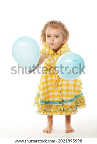 studio picture from a little girl with blue balloons over white background