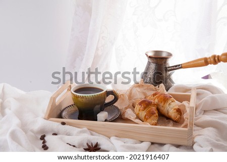Good morning black coffee with crispy croissants