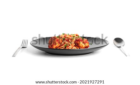 Spaghetti with meatballs in tomato sauce isolated on a white background. High quality photo