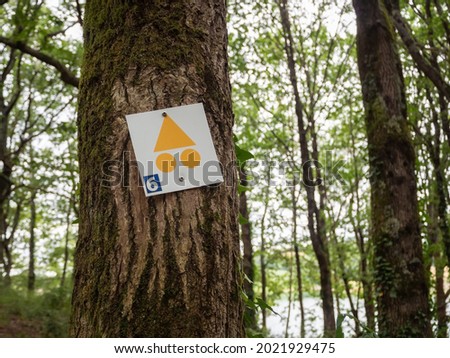 Hiking sign on a tree