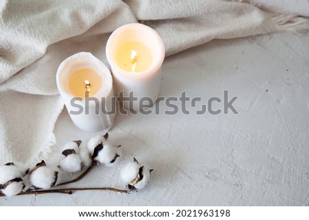 Spa relax background with candles and cotton, autumn mood, white cute picture, cosy autumn background