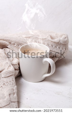 Cosy background with cup of coffee, hot chocolate 