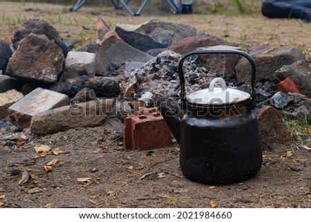black kettle by the stones.cooking in nature.