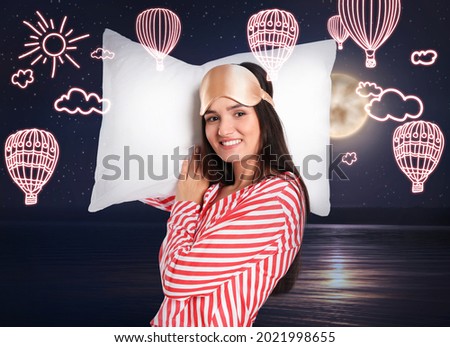 Beautiful woman dreaming about hot air balloon flight, night sky with full moon on background