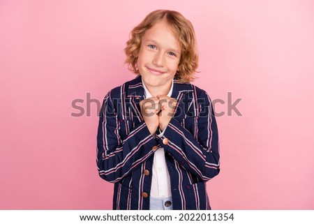 Photo of young handsome school boy happy positive smile glad wear jacket isolated over pink color background