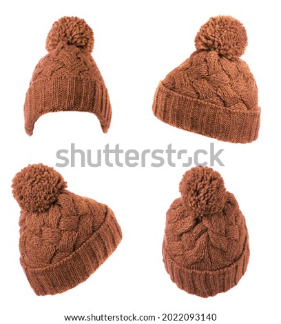  set of two knitted red hat isolated on white background .