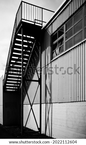 Steel Roofline Staircase in Black and White.  Industrial scene for use as a template or theme photo.