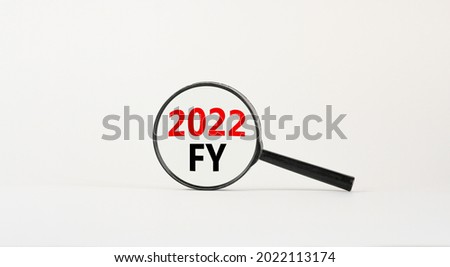 2022 FY fiscal new year symbol. Magnifying glass with words '2022 FY fiscal year' on beautiful white background. Business and 2022 FY fiscal new year concept, copy space.