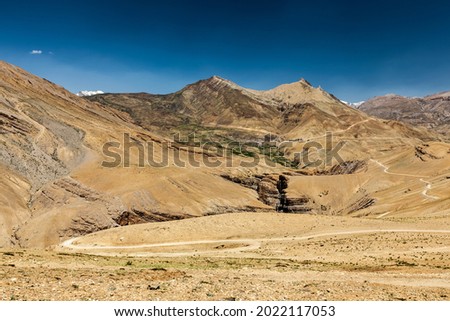 View of Spiti valley in Himalayas with Kibber village and road. Spiti valley, Himachal Pradesh, India Royalty-Free Stock Photo #2022117053