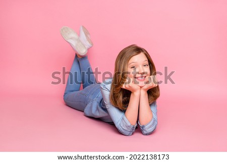 Full body profile side photo of young attractive girl happy positive smile lying floor isolated over pink color background Royalty-Free Stock Photo #2022138173