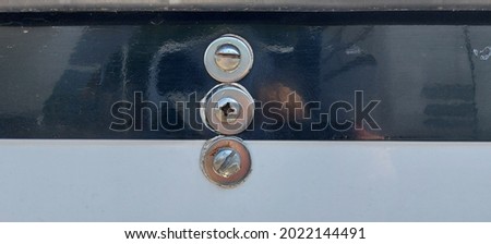 Metal rivets on the blue and white side of the yacht. Repair, yachting.