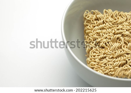 A block of dried Instant noodles on cup with  white background