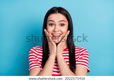 Photo of happy excited amazed surprised woman hold hands cheeks see huge sale isolated on blue color background