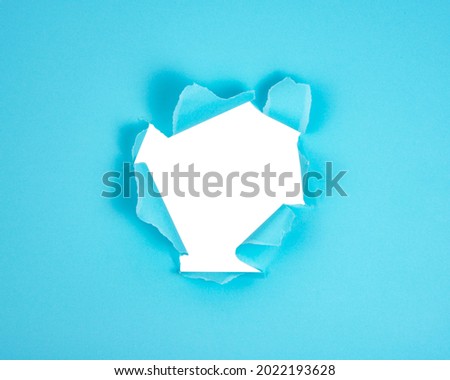 Blue torn paper whole with copyspace