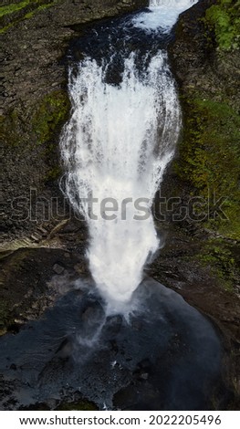 Haifoss waterfall in the highlands of Iceland, Aerial view. Dramatic landscape of Waterfall in Landmannalaugar canyon.