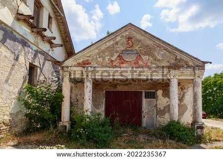 Soviet agricultural building in the village. Urban Architecture. Background with copy space for text. Abandoned objects of the USSR times