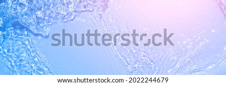 Serum texture close up. Light blue and pink gradient liquid gel background. Transparent beauty skincare sample. Cosmetic clear liquid cream smudge. Long banner with copy space Royalty-Free Stock Photo #2022244679