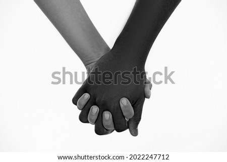 No racism. Black and white human hands in a modern handshake to show each other friendship and respect. Black and white couple. Handshake, concept of no apartheid. Hands black and white Royalty-Free Stock Photo #2022247712