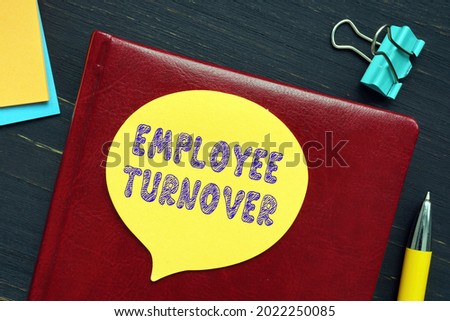 Business concept meaning EMPLOYEE TURNOVER with sign on the piece of paper. 
