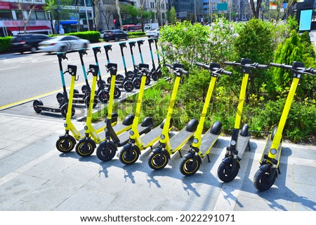 Electric kickboards parked side by side in the city, electricscooter Royalty-Free Stock Photo #2022291071