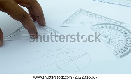 Design Professional using drawing tools close up