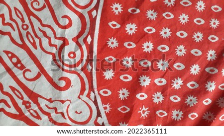 red cloth with batik pattern