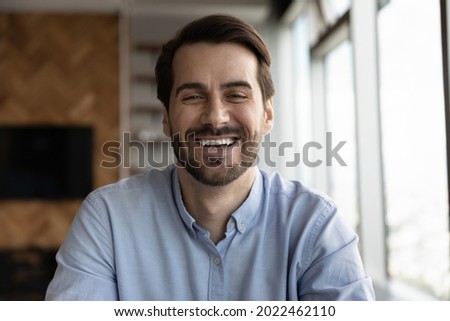 Happy 30s business man, professional, leader, entrepreneur in casual looking at camera, speaking, smiling. Teacher giving webinar via conference video call. Head shot portrait, screen view
