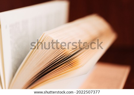 Open book with raised pages. The power of knowledge and wisdom. Place for your text.	 Royalty-Free Stock Photo #2022507377