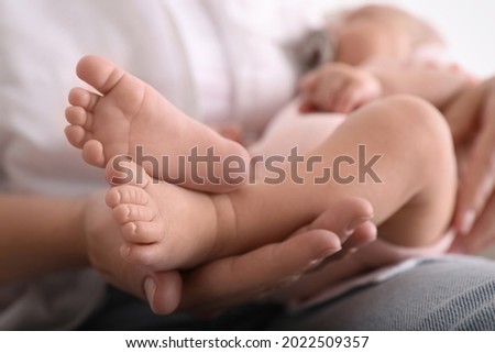 Mother with her cute baby, closeup view
