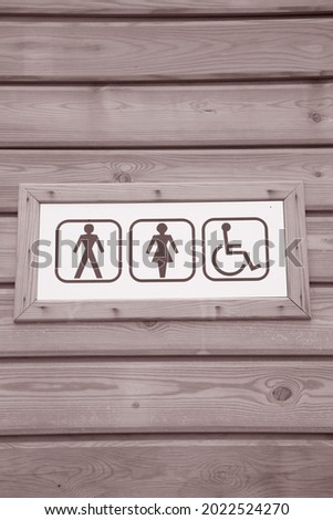 Ladies and Gents Toilet Sign in Black and White Sepia Tone