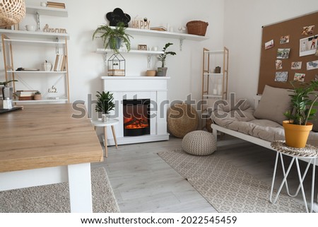 Interior of modern dining room with fireplace