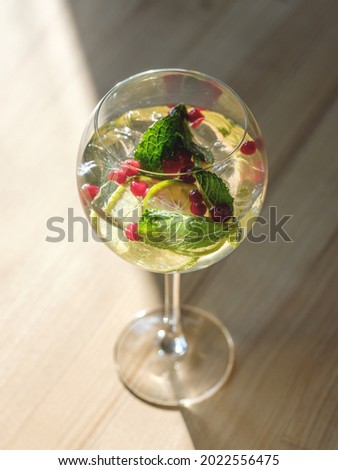 Glass of summer drink cocktail with alcohol and ice on interior cafe or bar background with copy space for text menu or ingredient for bartender cooking